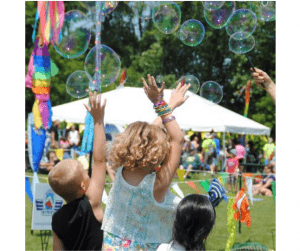 Kids playing with bubbles at Kite Fest