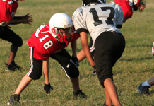 common sports injuries; kids playing football