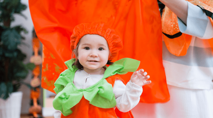 2021 halloween costume contest; girl in pumpkin costume
