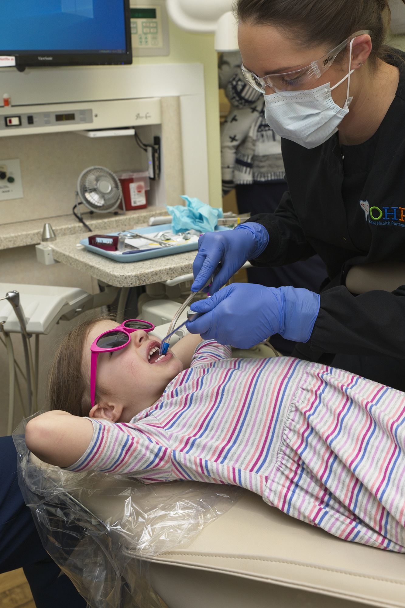 Child being seen at OHP for dental care